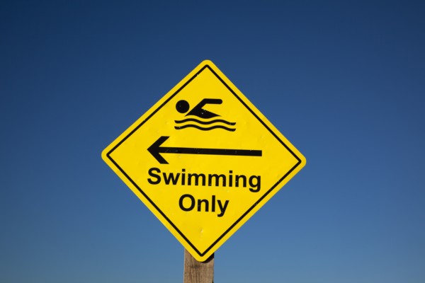 Shoreham-by-Sea, West Sussex, England. Sign indicating stretch of beach suitable for safe swimming.