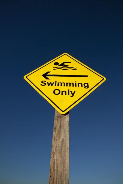 Shoreham-by-Sea, West Sussex, England. Sign indicating stretch of beach suitable for safe swimming.