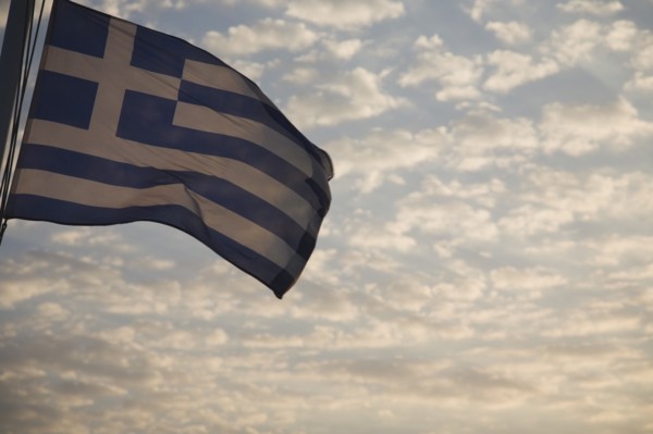 Samos, Northern Aegean, Greece. Greek flag flying from ferry between Samos and Kusadasi in Turkey