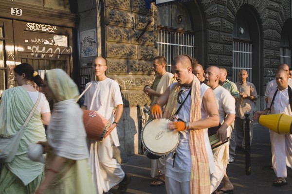 Budapest, Pest County, Hungary. Hare Krishna devotees singing and dancing on Andrassy UtIn Pest