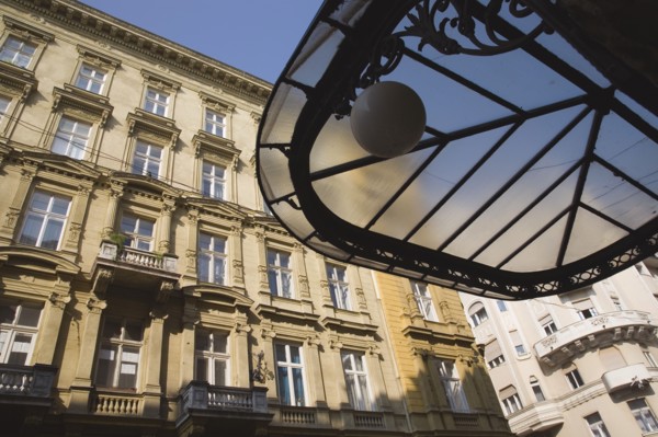 Budapest, Pest County, Hungary. Art Nouveau era apartment exterior facades with part seen underside