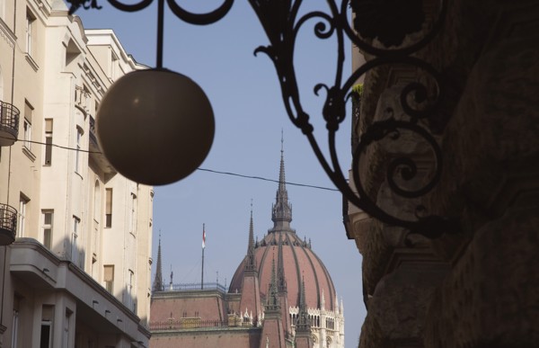 Budapest, Pest County, Hungary. Art Nouveau era apartment facades with domed roof of Hungarian