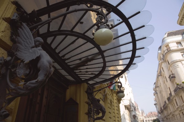 Budapest, Pest County, Hungary. Art nouveau building facade and apartment entrance with decorative
