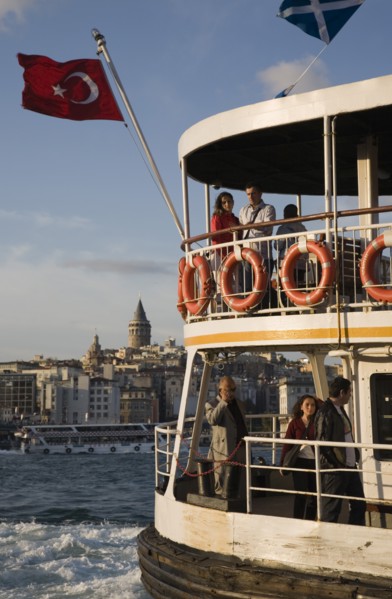 Istanbul, Turkey. Sultanahmet. Crowded passenger ferry flying Turkish flag on the Bosphorous with