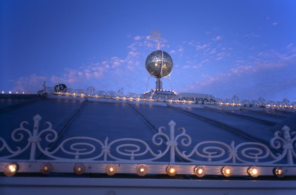 Brighton, East Sussex, England. Brighton Pier roof detail with mirrored ball and lights illuminated