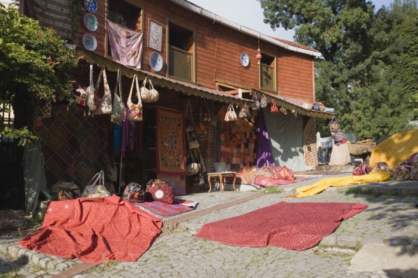 Istanbul, Turkey. Sultanahmet. Textiles and souvenirs displayed for sale next to Hagia Sophia.