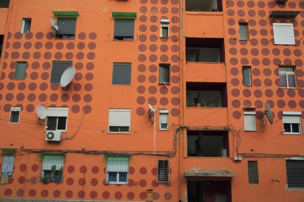Albania, Tirane, Tirana, Part view of exterior facade of apartment block painted orange with