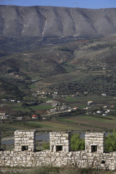 Albania, , Crenellated battlements of ancient castle with cannons with view across landscape beyond