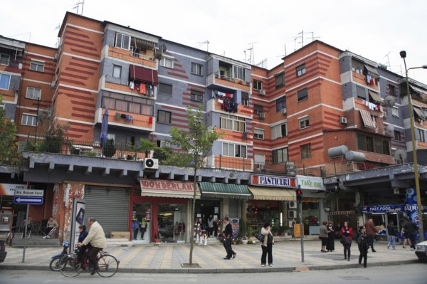 Albania, Tirane, Tirana, Colourful apartment buildings with washing hanging from balconies and