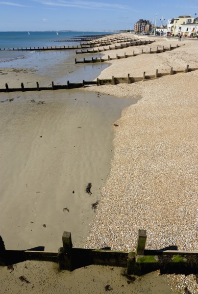 England, West Sussex, Bognor Regis, Wooden groynes at low tide used as sea defences against erosion