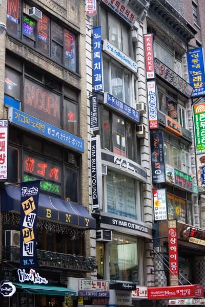 USA, New York, New York City, Manhattan  Korean signs for restaurants and shops on buildings in