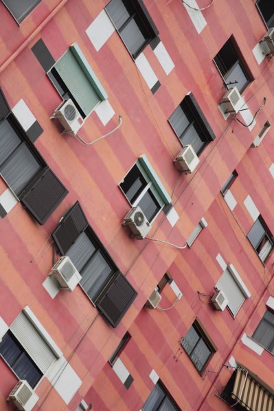 Albania, Tirane, Tirana, Angled part view of exterior facade of colourful apartment building with