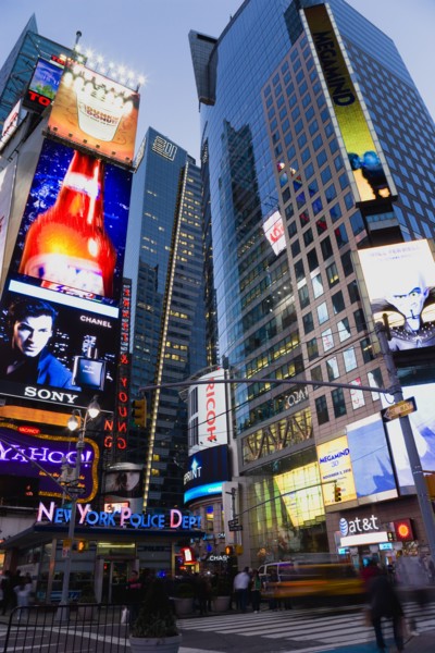 USA, New York, New York City, Manhattan  People walking at night in Times Square at the junction of