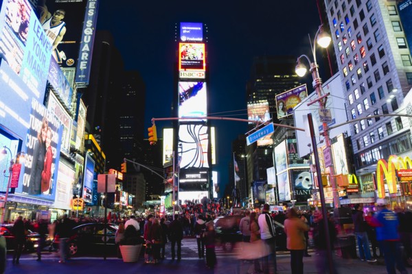 USA, New York, New York City, Manhattan  People walking at night in Times Square at the junction of