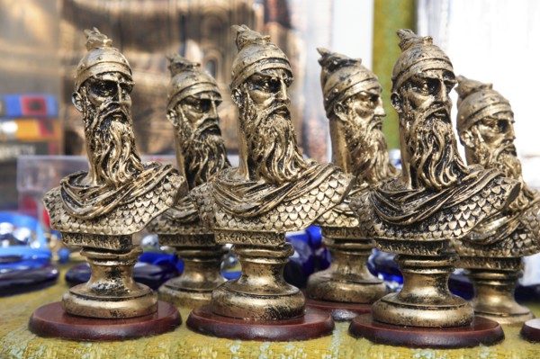 Albania, Kruja, Souvenirs displayed for sale on stalls in the market bazaar in the old town.