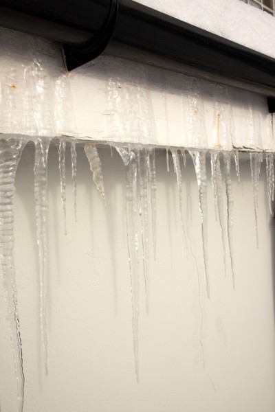 Weather, Winter, Ice, Large Icicles hanging from roof eaves.