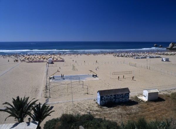 Portugal, Algarve, Praia da Rocha, View along beach with basketball & volleyball play areas