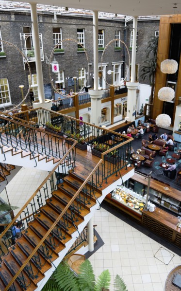 Ireland, County Dublin, Dublin City, Powerscourt Centre restaurants with people at tables beside