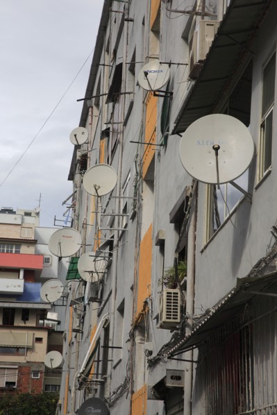 Albania, Tirane, Tirana, Satellite dishes on apartment building.