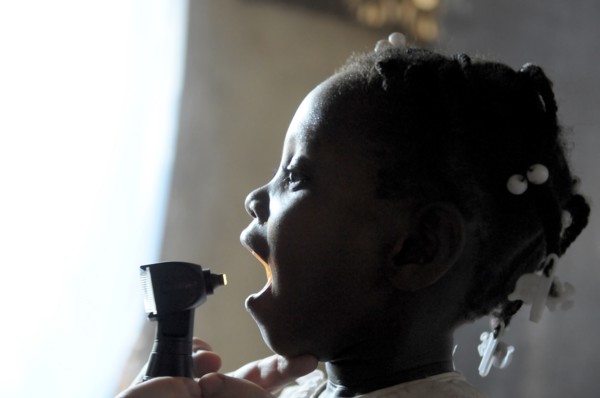 Haiti, La Gonave, Child being examined by medical staff provided by the Scottish Charity LemonAid