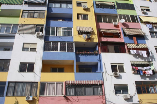 Albania, Tirane, Tirana, Part view of multi coloured apartment block exterior facade.