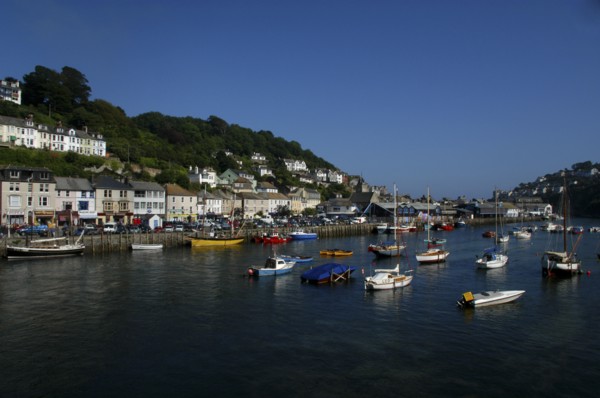 England, Cornwall, Looe, View of moored boats and view along the waterfront