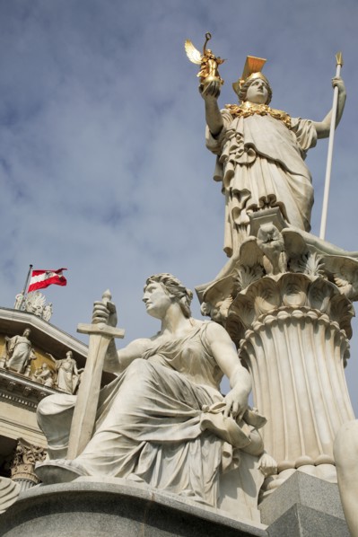 Statue of Athena raised on pillar above fountain in front of the Parliament building. Photo: