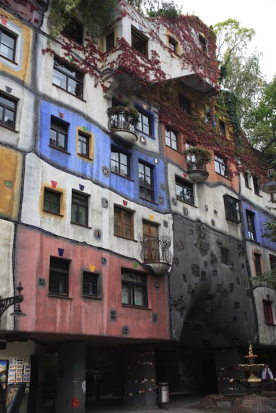 The Hundertwasser-Krawinahaus angled part view of exterior facade of apartment building. Photo: