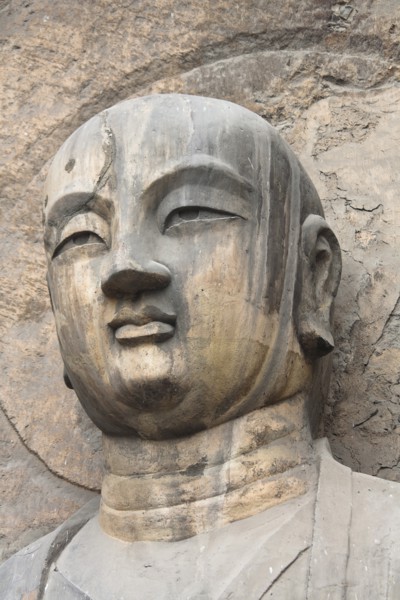 Carved Buddha statue in the Fengxian Temple Tang Dynasty Longmen Grottoes and Cave. Photo: Mel