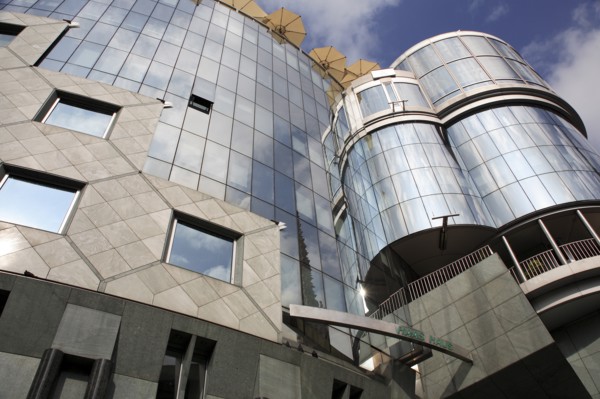 Exterior detail of the Haas Building or Haas Haus. Modern glass fronted and concrete office