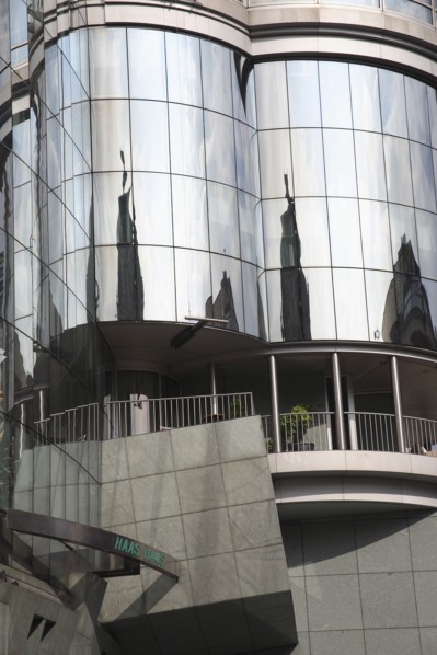 Exterior detail of the Haas Building or Haas Haus. Modern glass fronted and concrete office