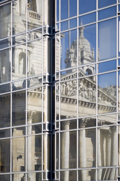 The Guildhall reflected in the windows of the Civic Offices. Originally built in 1890 but rebuilt