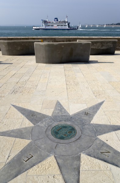 A plaque within a compass on the Millenium Walk commemorating its opening by Prince Phillip The