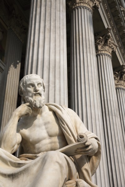 Statue of the Greek philosopher Herodotus in front of columns of the Parliament Building. Photo: