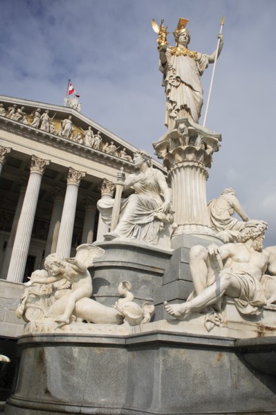 Statue of Athena raised on pillar above fountain in front of the Parliament building. Photo: