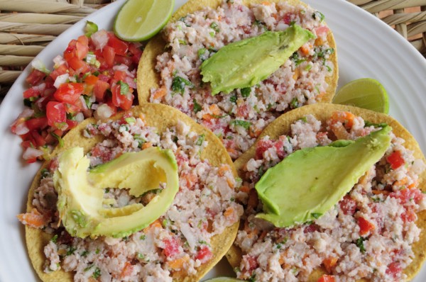 Mexico, Jalisco, Puerto Vallarta, Fish ceviche served with tacos avocado and tomato salsa. 
Photo