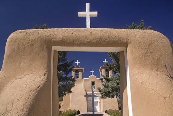 USA, New Mexico, Taos, Church of San Francisco de Asis. Entrance framing view to church exterior