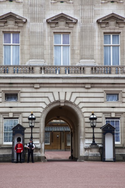 England, London, Westminster Buckingham Palace exterior with both Queens Guard and Metropolitan