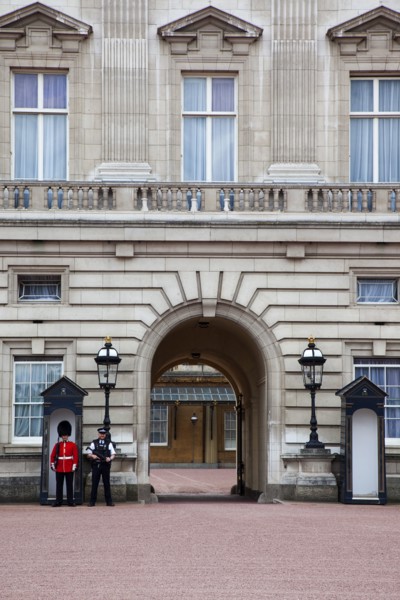 England, London, Westminster Buckingham Palace exterior with both Queens Guard and Metropolitan