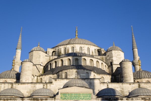 Turkey, Istanbul, Sultanahmet Camii The Blue Mosque domes seen from the Courtyard with Arabic text