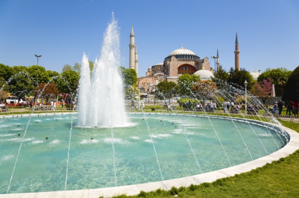 Turkey, Istanbul, Sultanahmet Haghia Sophia with dome and minarets beyond the water fountain in the