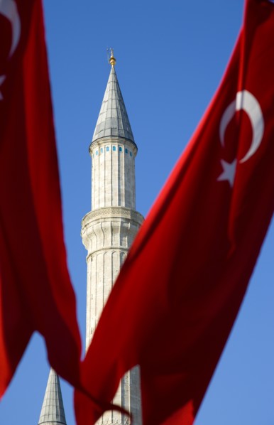 Turkey, Istanbul, Sultanahmet Haghia Sophia minaret and Turkish red flag with white crescent moon