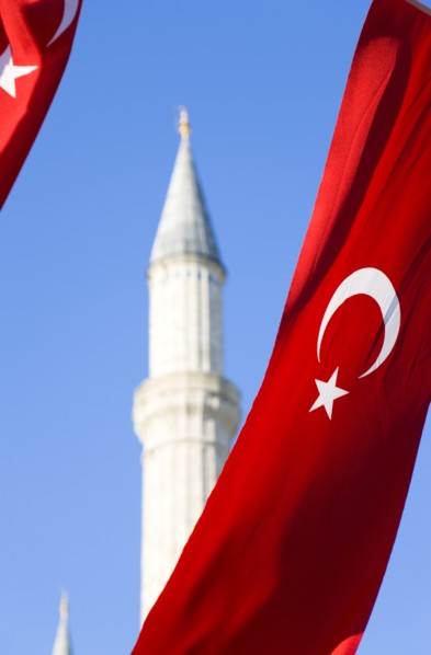 Turkey, Istanbul, Sultanahmet Haghia Sophia minaret and Turkish red flag with white crescent moon