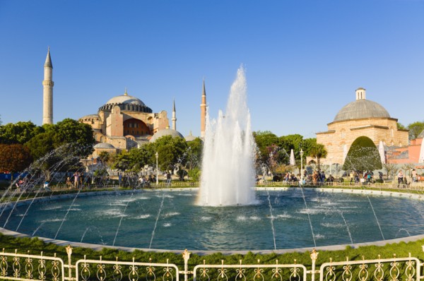 Turkey, Istanbul, Sultanahmet Haghia Sophia with dome and minarets beyond the water fountain and