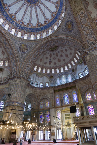 Turkey, Istanbul, Sultanahmet Camii The Blue Mosque interior with people at prayer beneath