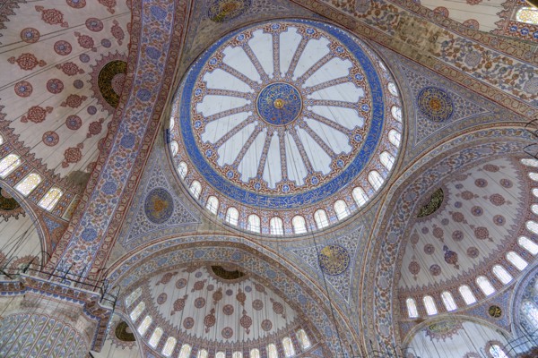 Turkey, Istanbul, Sultanahmet Camii The Blue Mosque interior with decorated painted domes. 
Photo