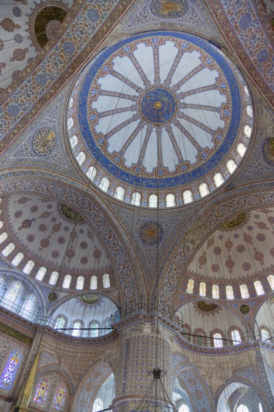 Turkey, Istanbul, Sultanahmet Camii The Blue Mosque interior with decorated painted domes. 
Photo