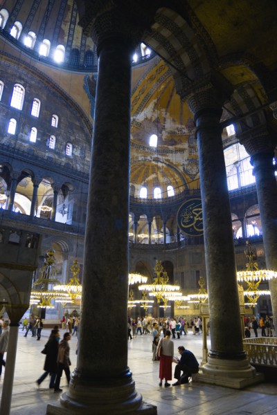 Turkey, Istanbul, Sultanahmet Haghia Sophia Sightseeing tourists beneath the dome with murals and