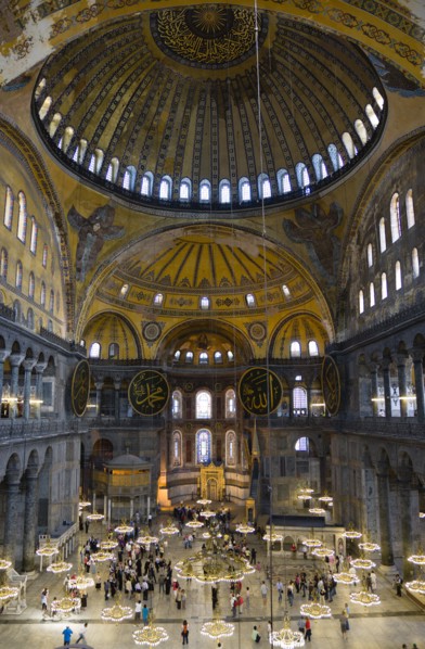 Turkey, Istanbul, Sultanahmet Haghia Sophia Sightseeing tourists beneath the dome with murals and