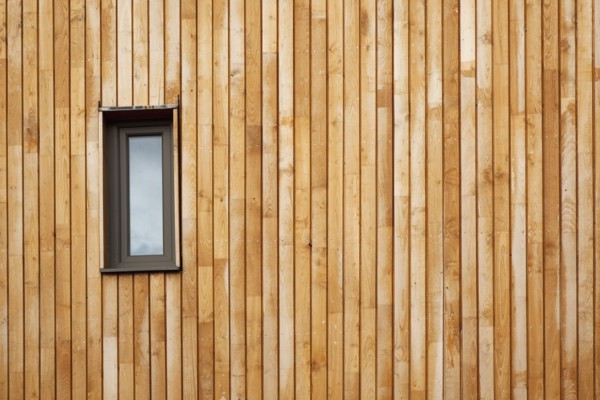 Graylingwell Park detail of wood cladding on the exterior of the modern eco friendly house.